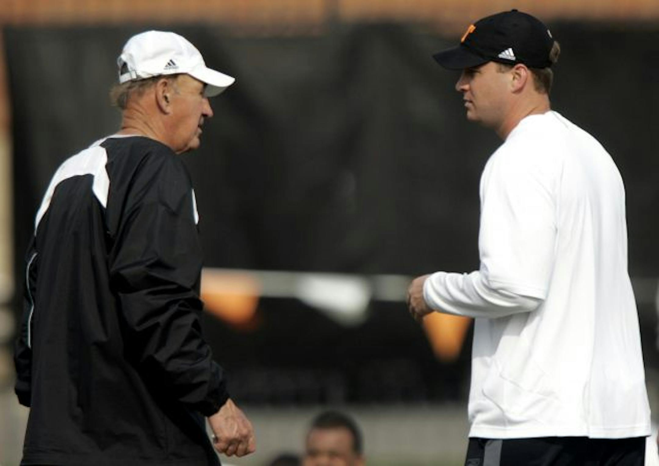 Tennessee coach Lane Kiffin talked with his father and defensive coordinator, Monte Kiffin, during the first day of spring practice in March. Monte Kiffin left his job as the highest-paid assistant in the NFL to become the Volunteers' defensive coordinator and coach with his son.