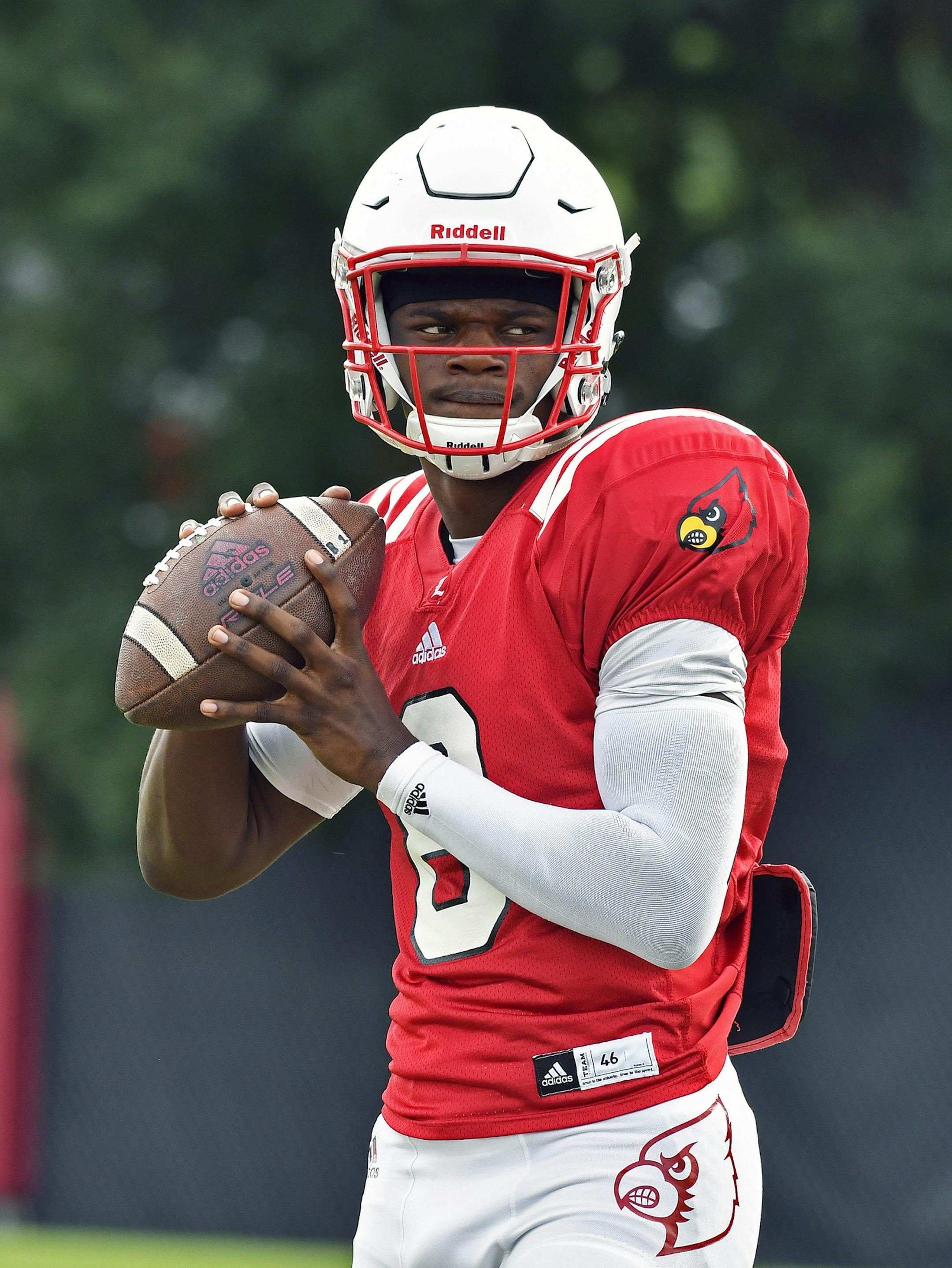 University of Louisville sophomore quarterback Lamar Jackson warms up before the start of the team's morning practice at the Louisville practice facility, Tuesday, Aug. 16, 2016 in Louisville Ky. (AP Photo/Timothy D. Easley)