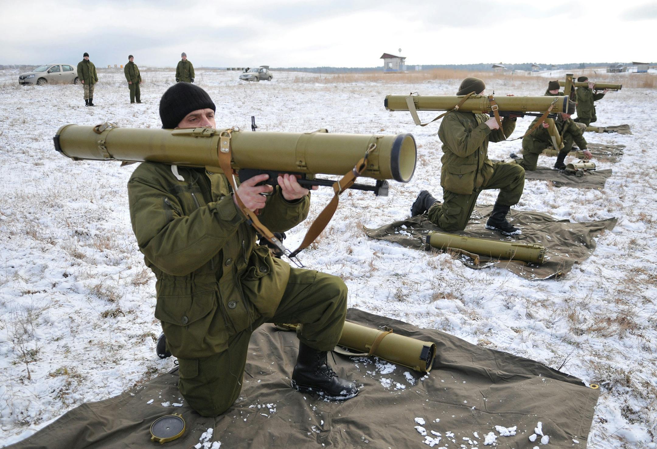 Ukrainian army soldiers perform a weapons exercise at a training ground outside Lviv, western Ukraine, Thursday, Feb. 5, 2015. The Ukrainian government is anxious to use Thursday's visit by U.S. Secretary of State John Kerry to Kiev to reiterate its plea for lethal aid. President Barack Obama has opposed the idea of sending weapons to Ukraine but sources in his administration say this position could change in the light of recent events. (AP Photo/Pavlo Palamarchuk) ORG XMIT: MIN2015020512100921