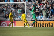 Loons forward Tani Oluwaseyi beats Columbus goalie Patrick Schulte from in tight to snatch a tie in the home opener.