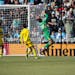 Loons forward Tani Oluwaseyi beats Columbus goalie Patrick Schulte from in tight to snatch a tie in the home opener.