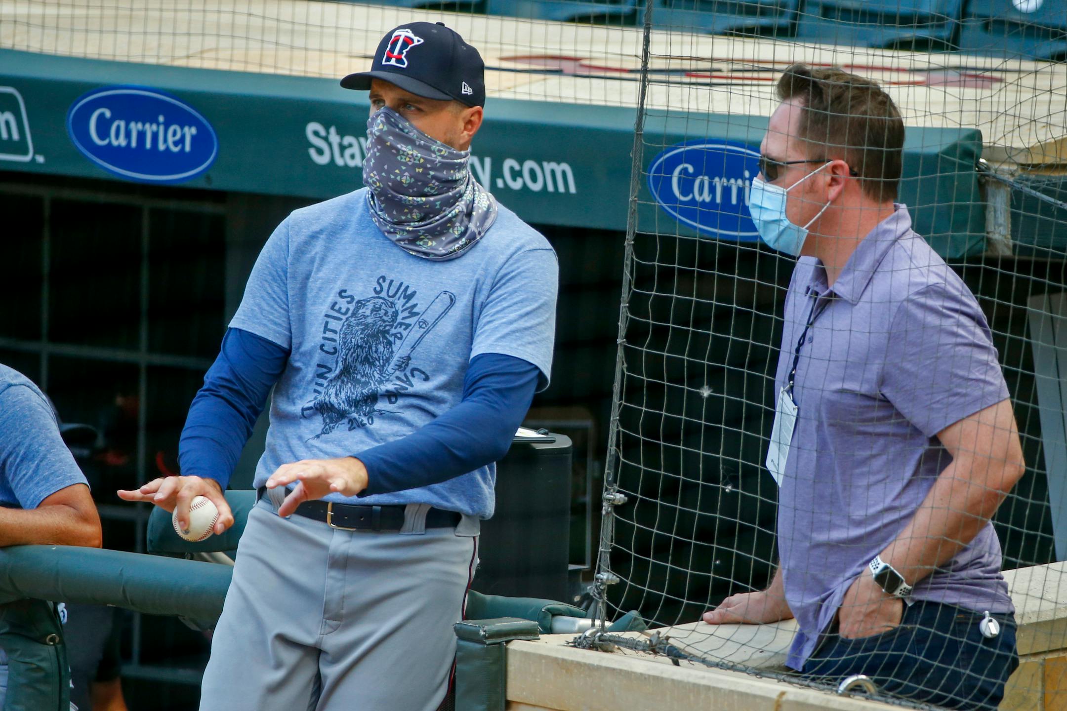 President of Baseball Operations Derek Falvey, right, recently talked with Twins manager Rocco Baldelli during training camp at Target Field.