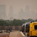 A smoky haze enveloped Minneapolis in June. Forecasters say smoke from continuing Canadian wildfires has the potential to make air in the Twin Cities 