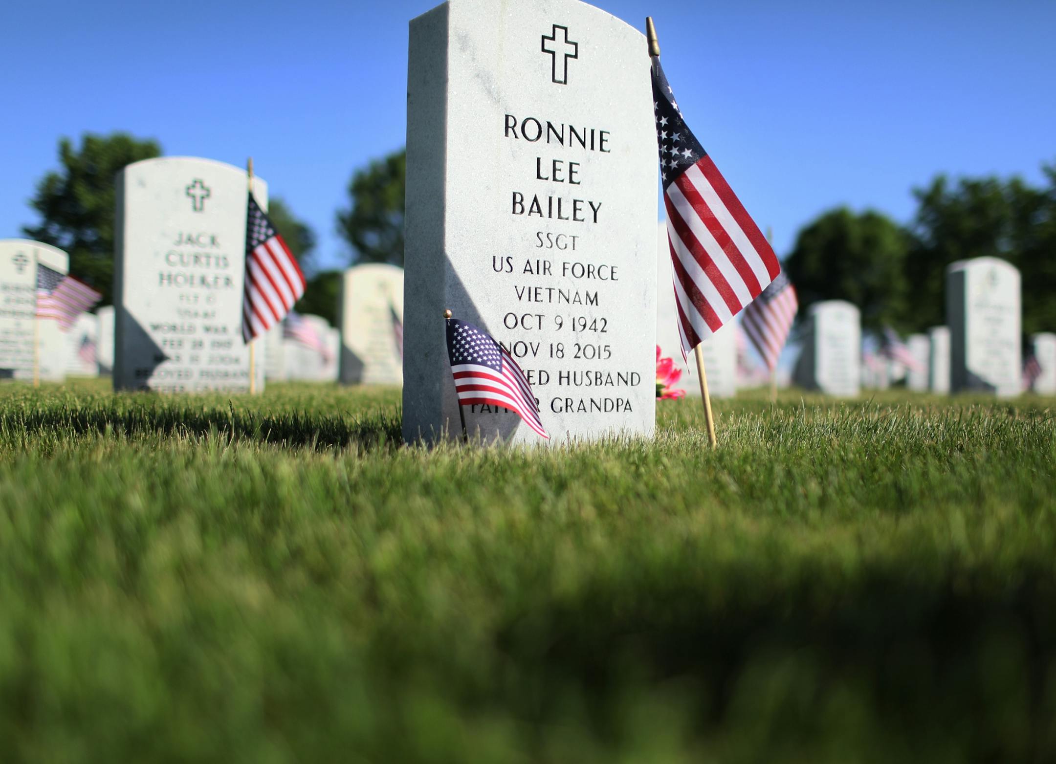 The grave of Vietnam Vet Ronnie Lee Bailey was adorned with a mini flag as well for Memorial Day Saturday, May 26, 2018, at Fort Snelling National Cemetery in Bloomington, MN.