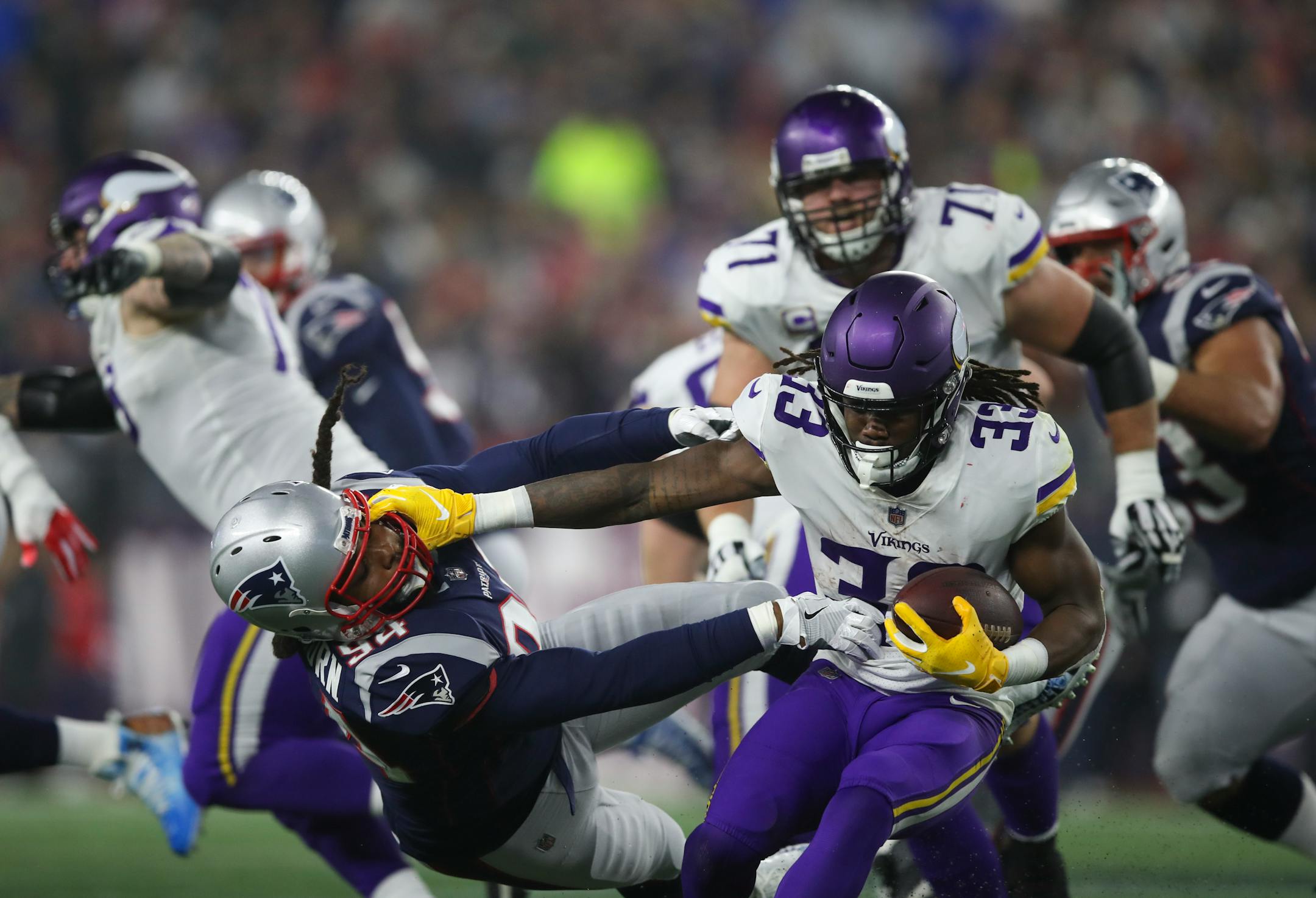Minnesota Vikings running back Dalvin Cook (33) held off New England Patriots defensive end Adrian Clayborn (94) while ultimately gaining nothing on a fourth quarter run. ] JEFF WHEELER � jeff.wheeler@startribune.com The Minnesota Vikings lost to the New England Patriots 24-10 in an NFL game Sunday evening, December 2, 2018 at Gillette Stadium in Foxborough, MA.