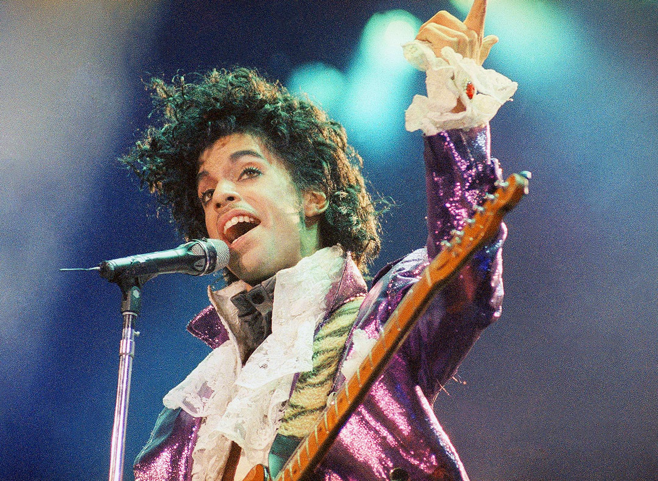 In this Feb. 18, 1985 file photo, Prince performs at the Forum in Inglewood, Calif.