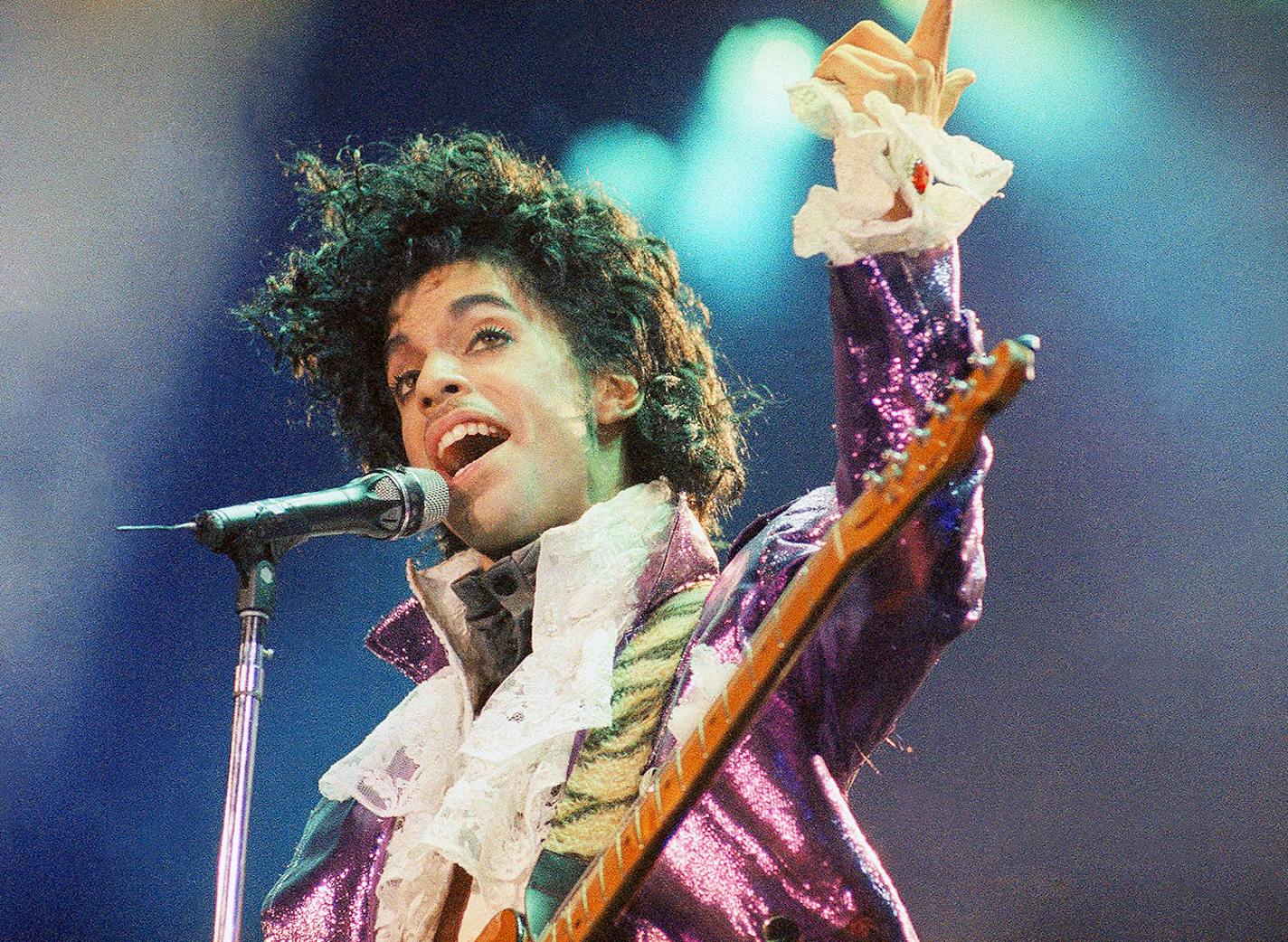 In this Feb. 18, 1985 file photo, Prince performs at the Forum in Inglewood, Calif.