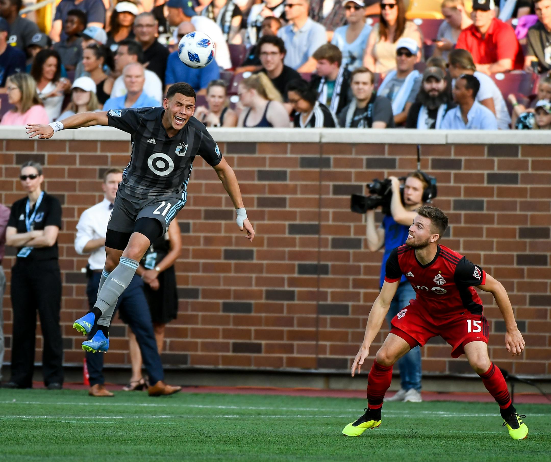 Toronto FC defender Eriq Zavaleta (15) looked on as Minnesota United forward Christian Ramirez (21) jumped for a header in the second half. ] AARON LAVINSKY ï aaron.lavinsky@startribune.com Minnesota United played Toronto FC on Wednesday, July 4, 2018 at TCF Bank Stadium in Minneapolis, Minn.
