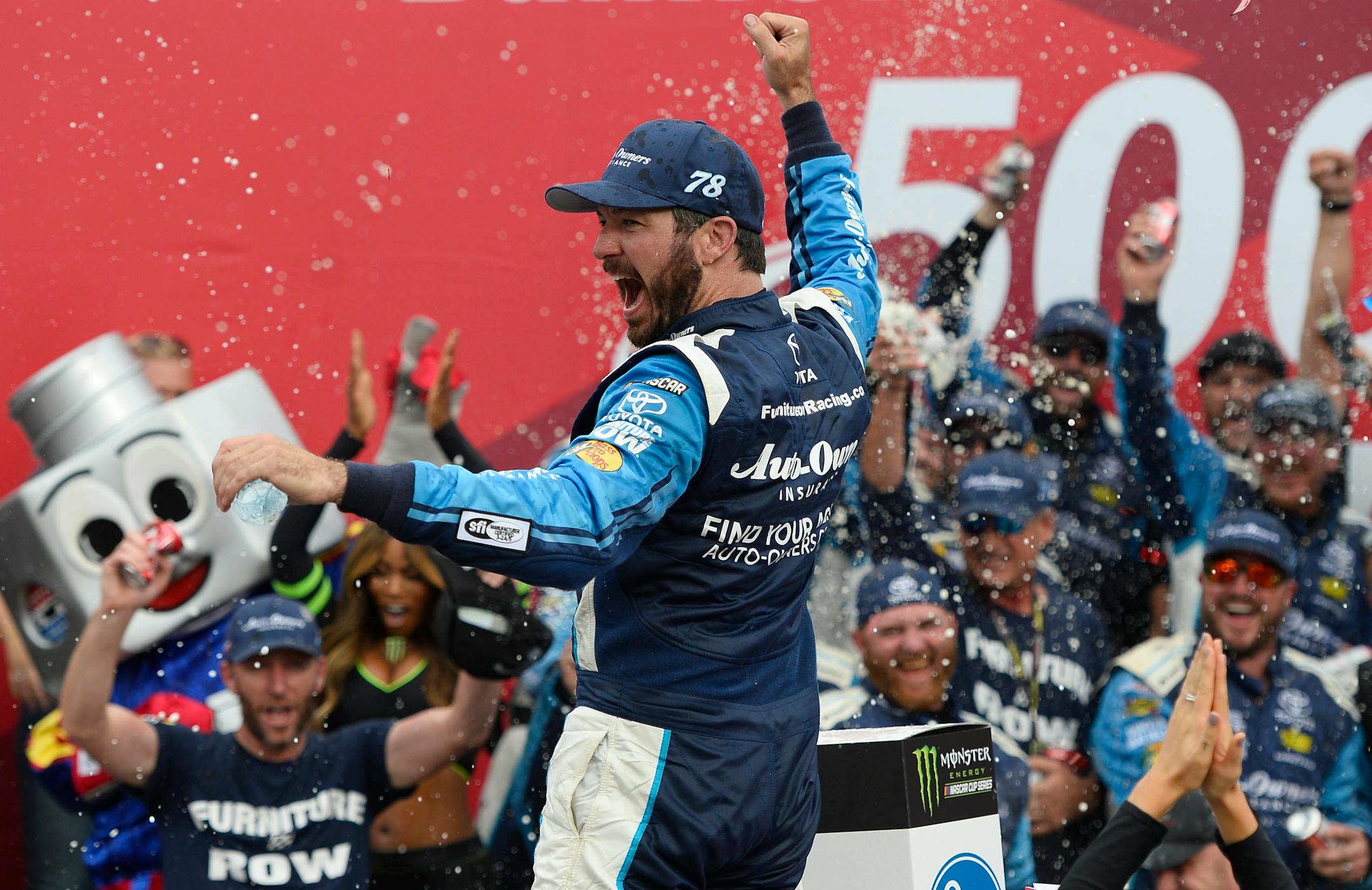 Martin Truex Jr. celebrated in Victory Lane after winning the Bank of America 500 at Charlotte Motor Speedway in Concord, N.C., on Sunday.