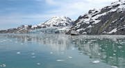 Glacier Bay channel near Margerie Glacier in Alaska, view of water and mountains.