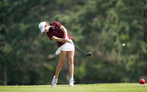 Bella Leonhart of Forest Lake hits a tee shot on the 10th hole at Bunker Hills Golf Club on Tuesday.