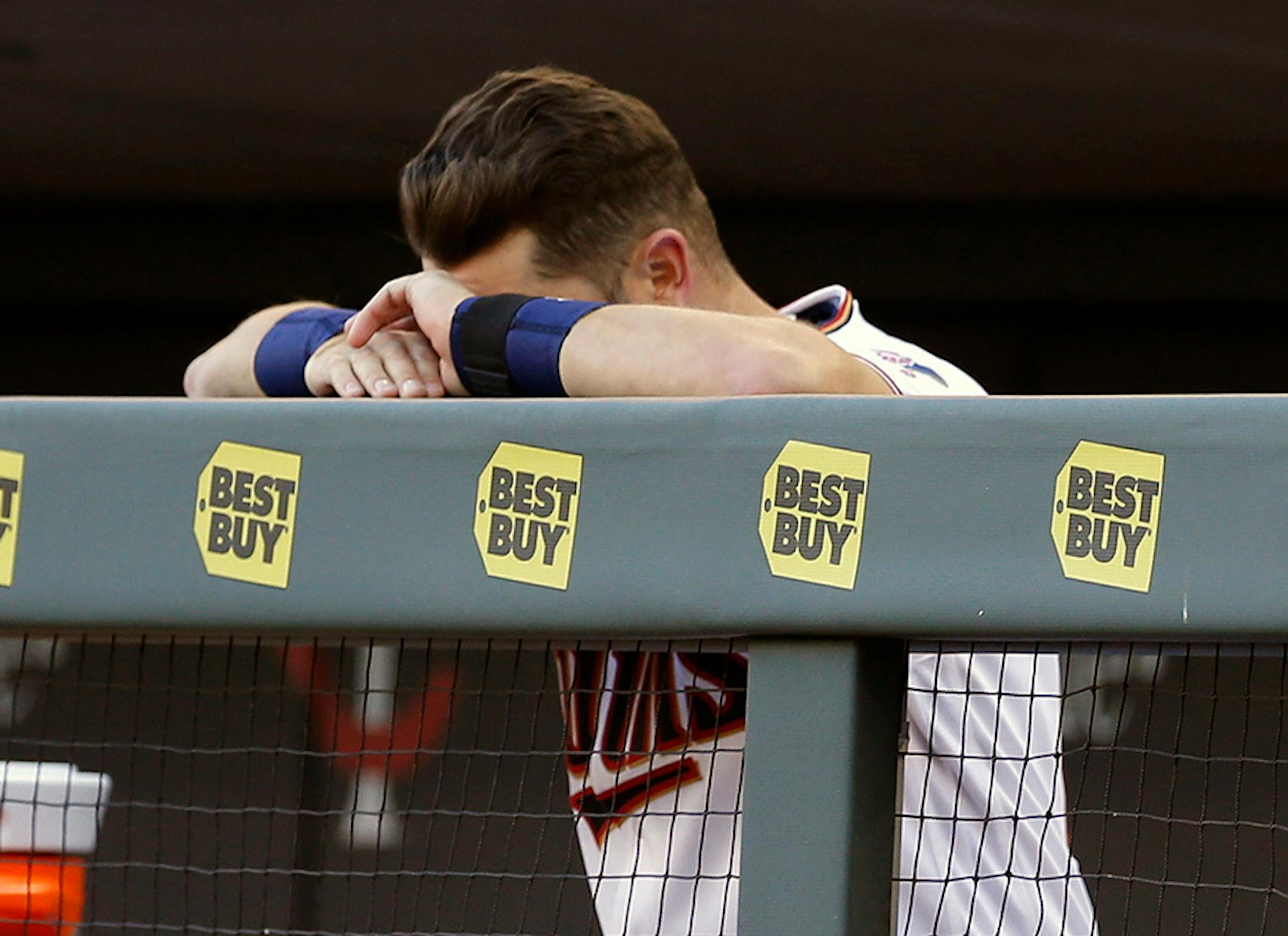 Minnesota Twins Trevor Plouffe rests his head on his hands at the end of a game against the White Sox Monday, April 11, 2016, in Minneapolis. The White Sox won 4-1, handing the Twins their seventh loss against no wins for the young season.
