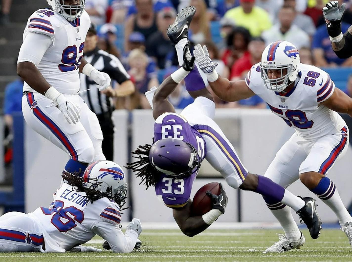 Minnesota Vikings running back Dalvin Cook (33) is tackled by the Buffalo Bills' Trae Elston (36) in the first quarter on Thursday, Aug. 10, 2017, at New Era Field in Orchard Park, N.Y.