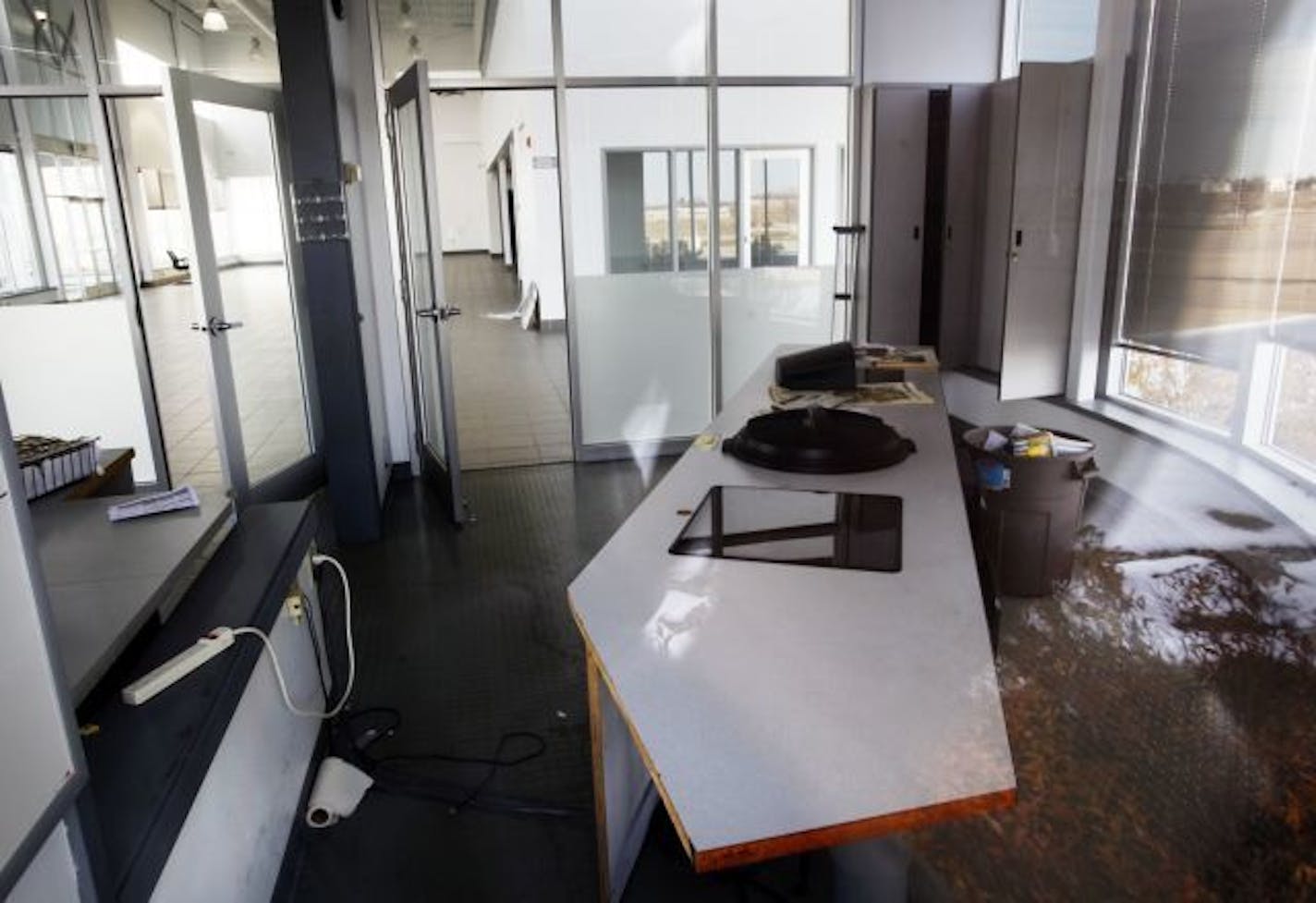 Scott County has bought one of the six Denny Hecker auto dealerships that Hecker closed in late 2008 and is going to transform it into a major transit hub. In this photo:] A desk in the old dealership.