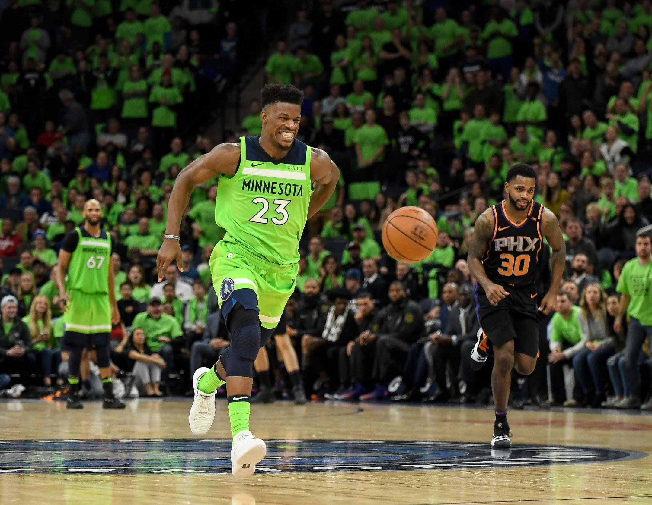 Minnesota Timberwolves guard Jimmy Butler (23) winced in pain while holding his backside as he broke away for a dunk in the fourth quarter against the Phoenix Suns. ] AARON LAVINSKY ï aaron.lavinsky@startribune.com The Minnesota Timberwolves played the Phoenix Suns on Saturday, Dec. 16, 2017 at Target Center in Minneapolis, Minn.