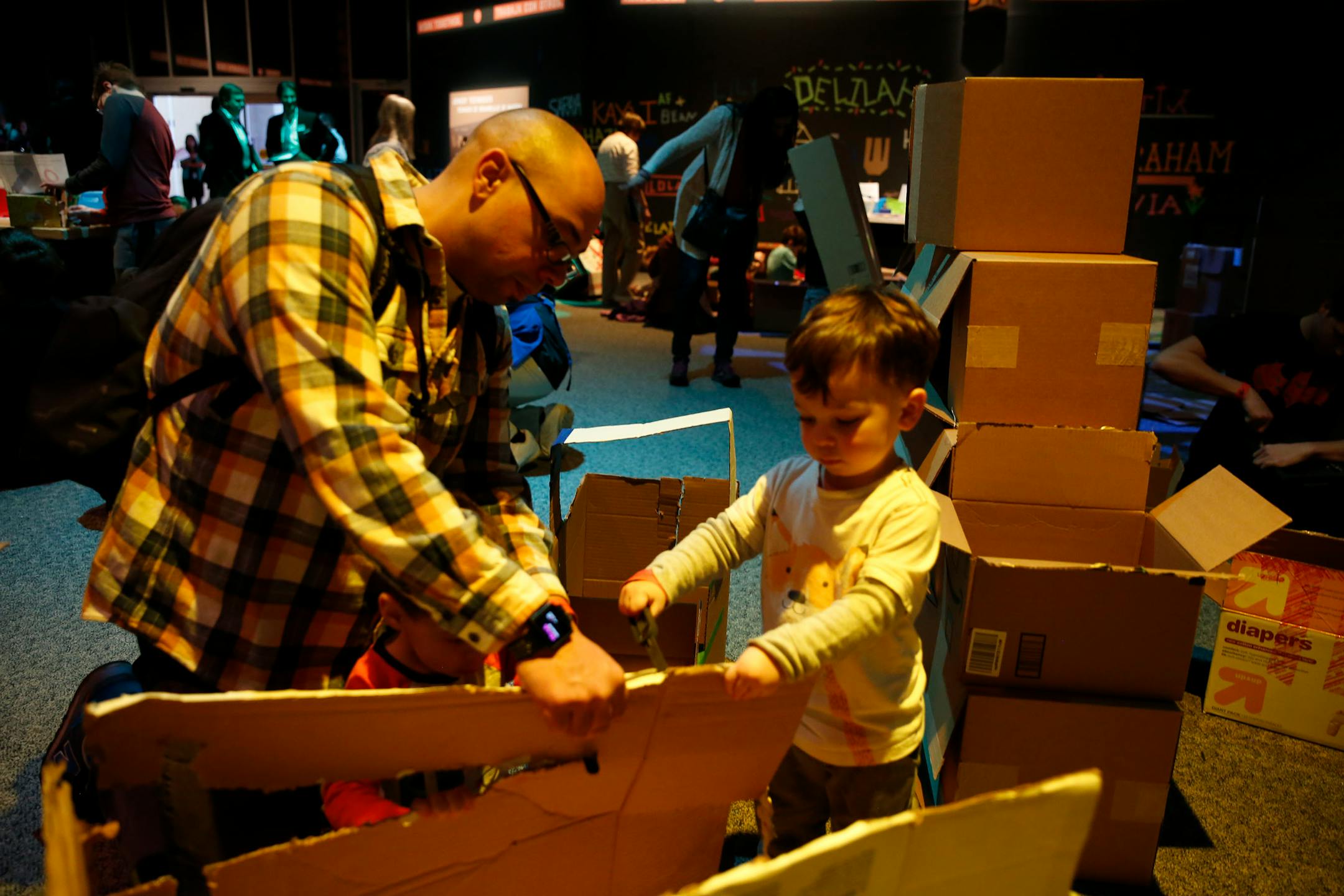 Visitors at the Science Museum of Minnesota's cardboard engineering gallery Thursday in St. Paul used cutting tools and connectors to make a creation.