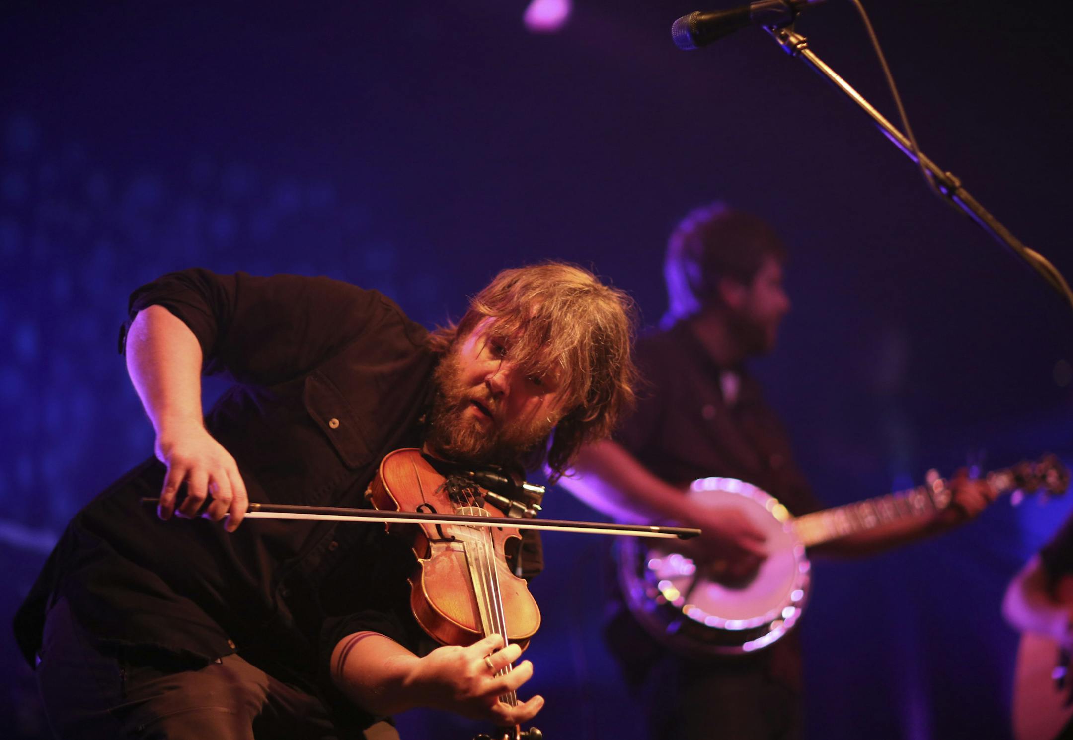 Duluth's Trampled By Turtles played the second of three sold out shows at First Ave. Thursday night, April 18, 2013 in celebration of their 10 years as a band. Trampled By Turtles' fiddler, Ryan Young, foreground, with banjo player Dave Carroll early in the band's performance Thursday night at First Ave. ] JEFF WHEELER • jeff.wheeler@startribune.com