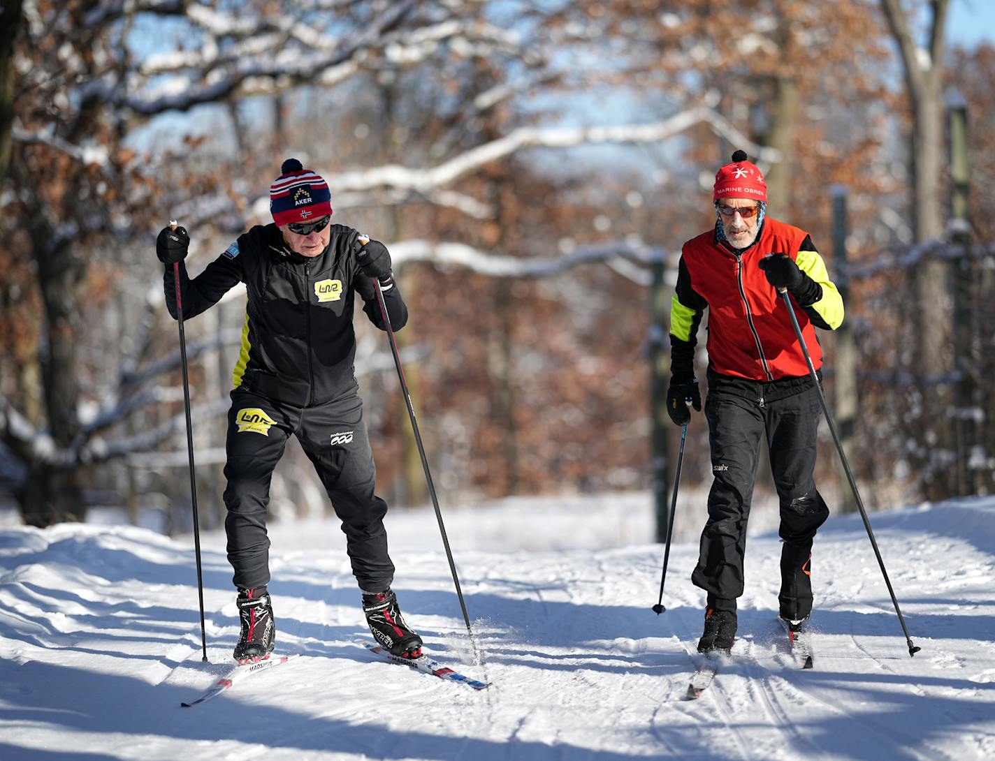 Osland, left, said he gains most of his enjoyment from relationships made through skiing. Above, he skied with friend Peter Dorsen.