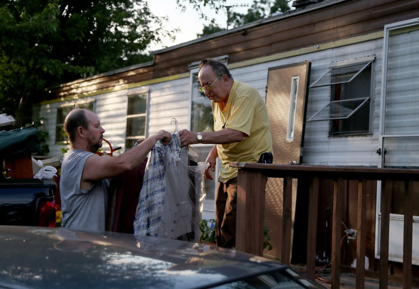 Jerry Wonsewicz, 80, right, gets help moving his belongings from his one Gary Wonsewicz, 57, both residents of Lowry Grove mobile home park on June 30, 2017, in St. Anthony, Minn. Lowry Grove closed its gate and all residents had to be gone by midnight on July 1, The space is slated to be redeveloped.