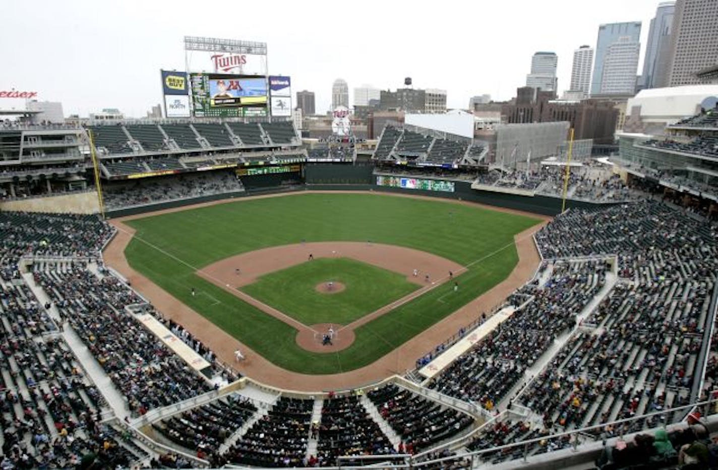 Fans watch a baseball game at Target Field between Minnesota and Louisiana Tech as part of an open house, Saturday, March 27, 2010 in Minneapolis. It is the first game played at the new home of the MInnesota Twins.