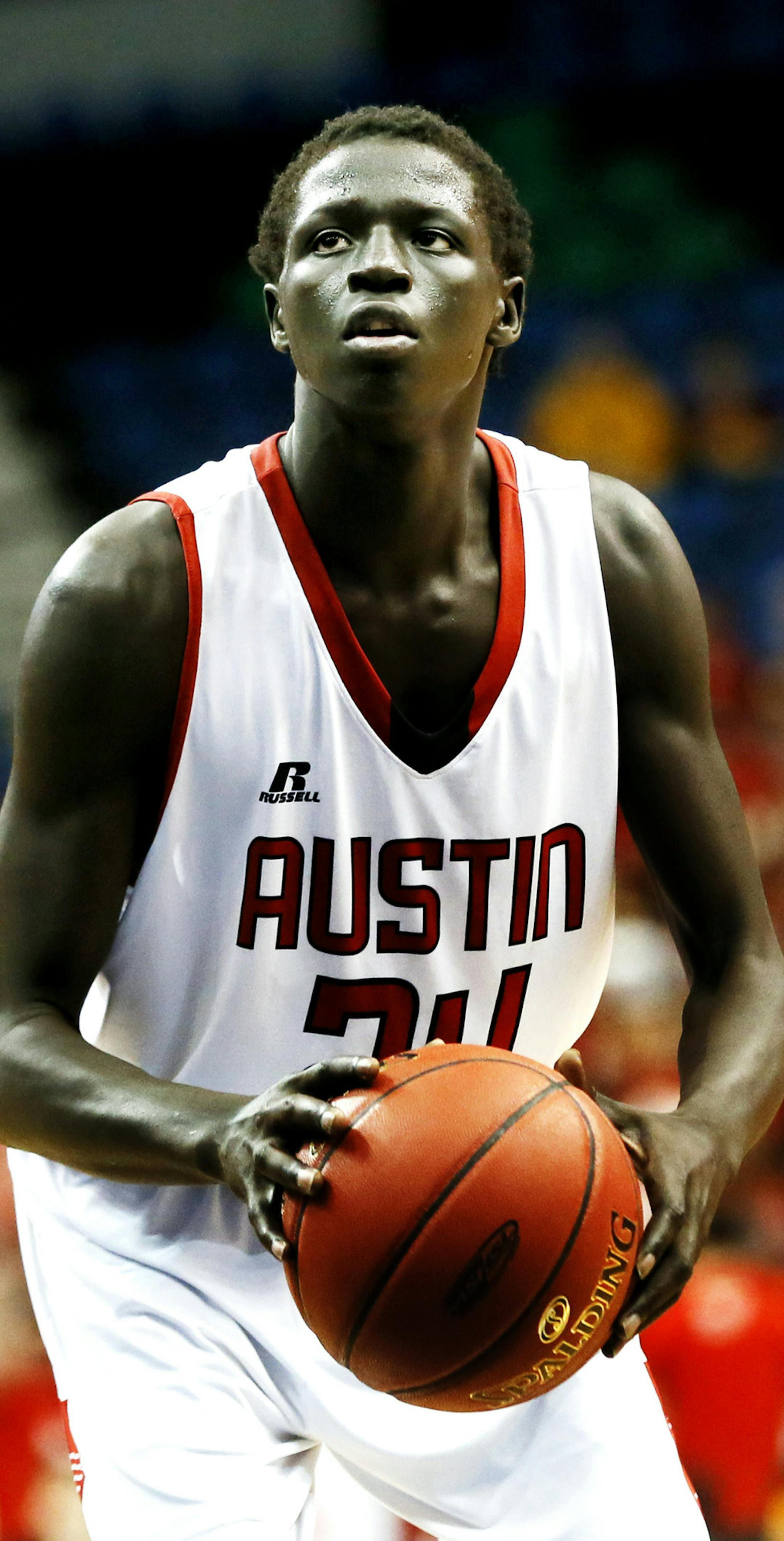 Gach Gach of Austin shoots a free throw during class 3A Minnesota State boys basketball tournament between Austin and Holy Family at Target Center March 13, 2014 in Minneapolis, MN. ] JERRY HOLT jerry.holt@startribune.com