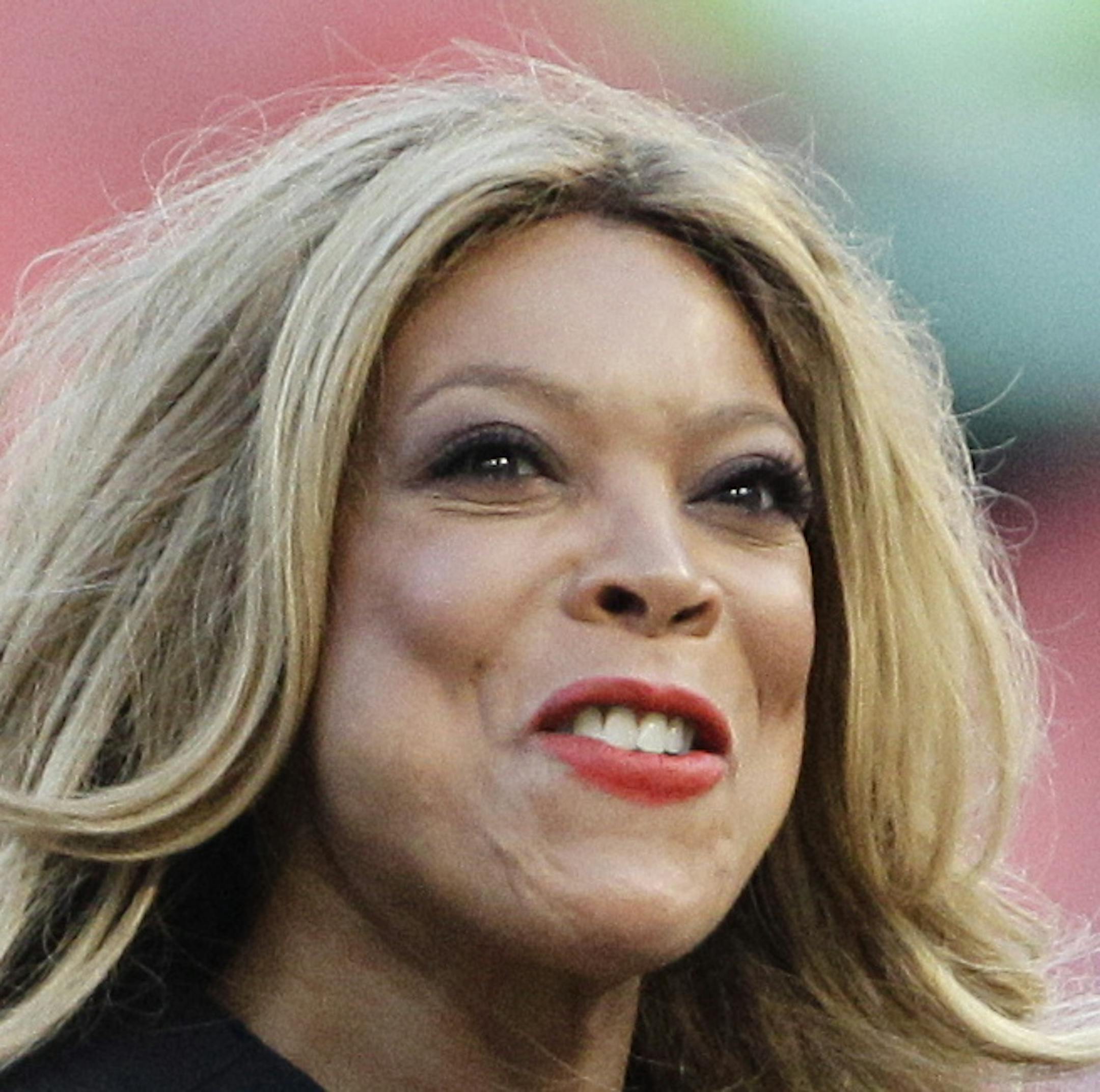 TV personality Wendy Williams throws out the first ceremonial pitch before the baseball game between the St. Louis Cardinals and Florida Marlins in Miami, Thursday, Aug. 4, 2011. The Cardinals won 7-4. (AP Photo/J Pat Carter)