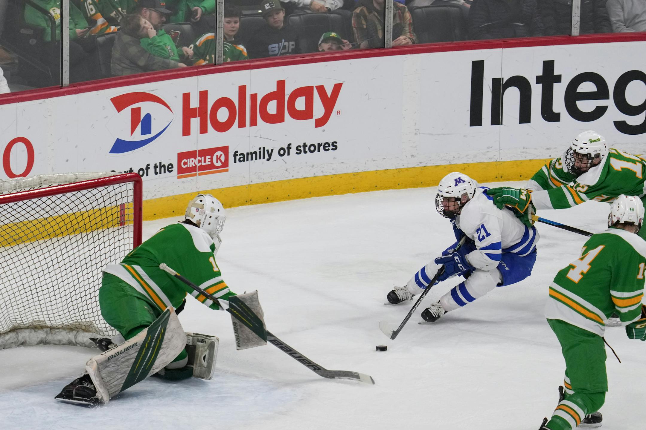 Edina goaltender Robbie Clarkowski (1) blocks a shot from Minnetonka forward Sam Scheetz (21) in the first period.