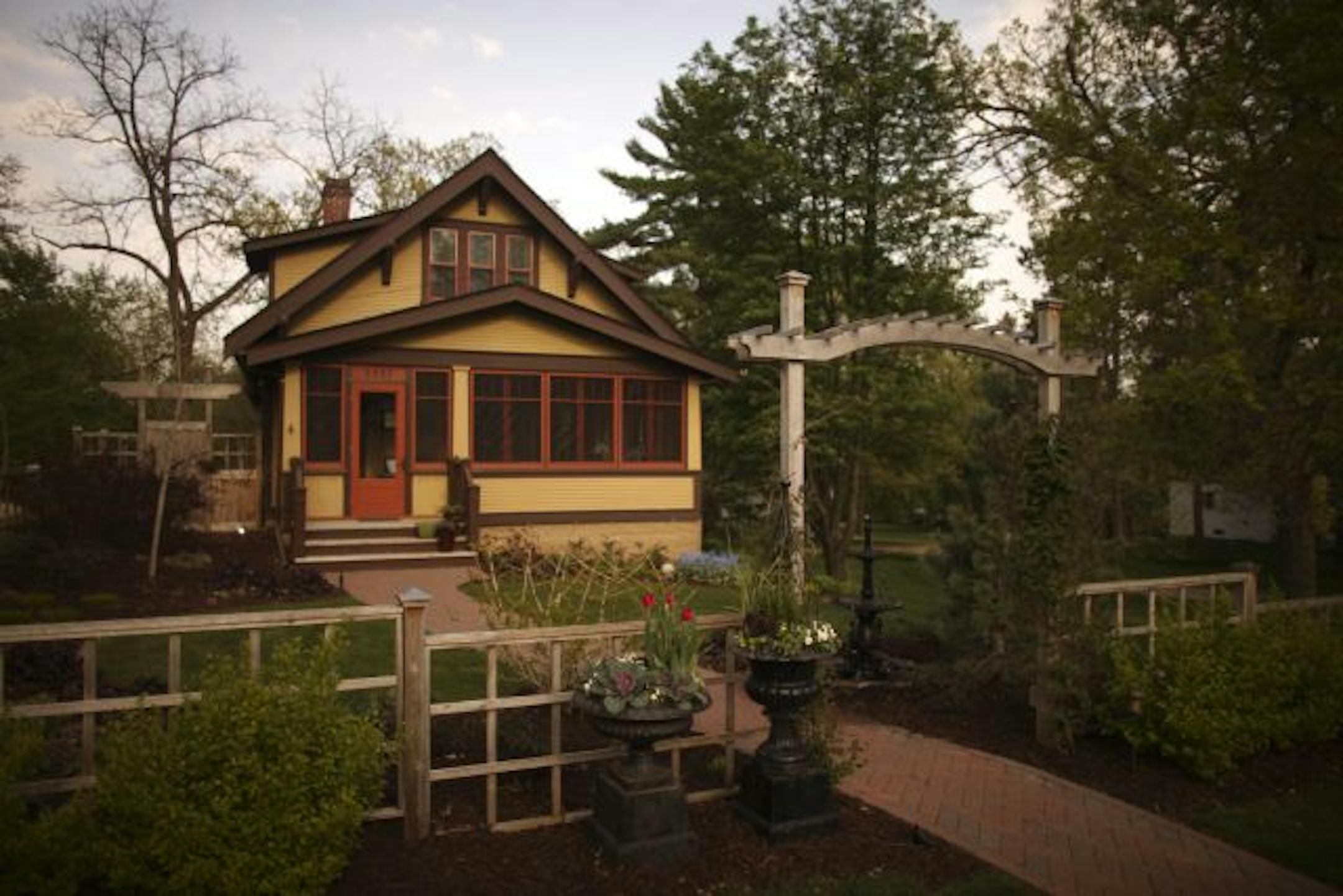 Tom DeGree and Dean Schlaak have transformed their Lake Elmo landscape into a series of gardens. Last year, they planted a huge vegetable garden, but didn't have time to tend it. This year, they're mixing edibles in with the ornamental plants in containers and garden beds.