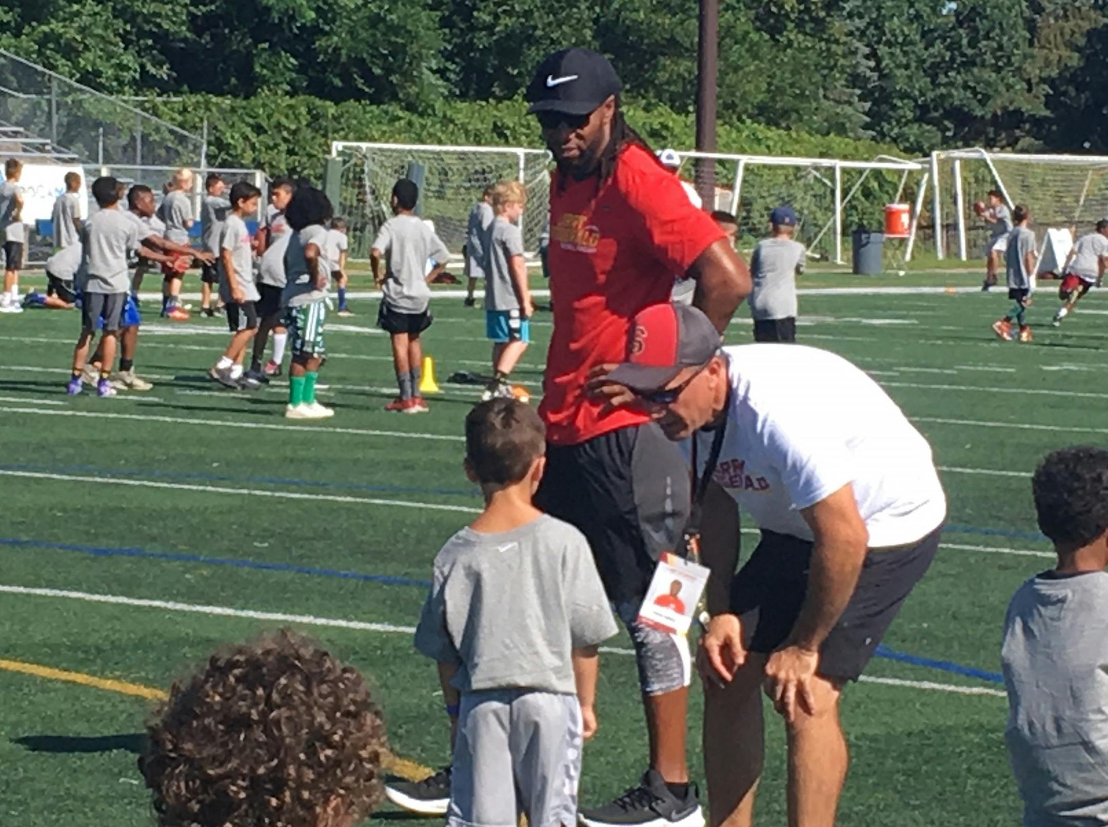 Larry Fitzgerald looks on during his football camp Monday at Academy of Holy Angels in Richfield. photo/Michael Rand