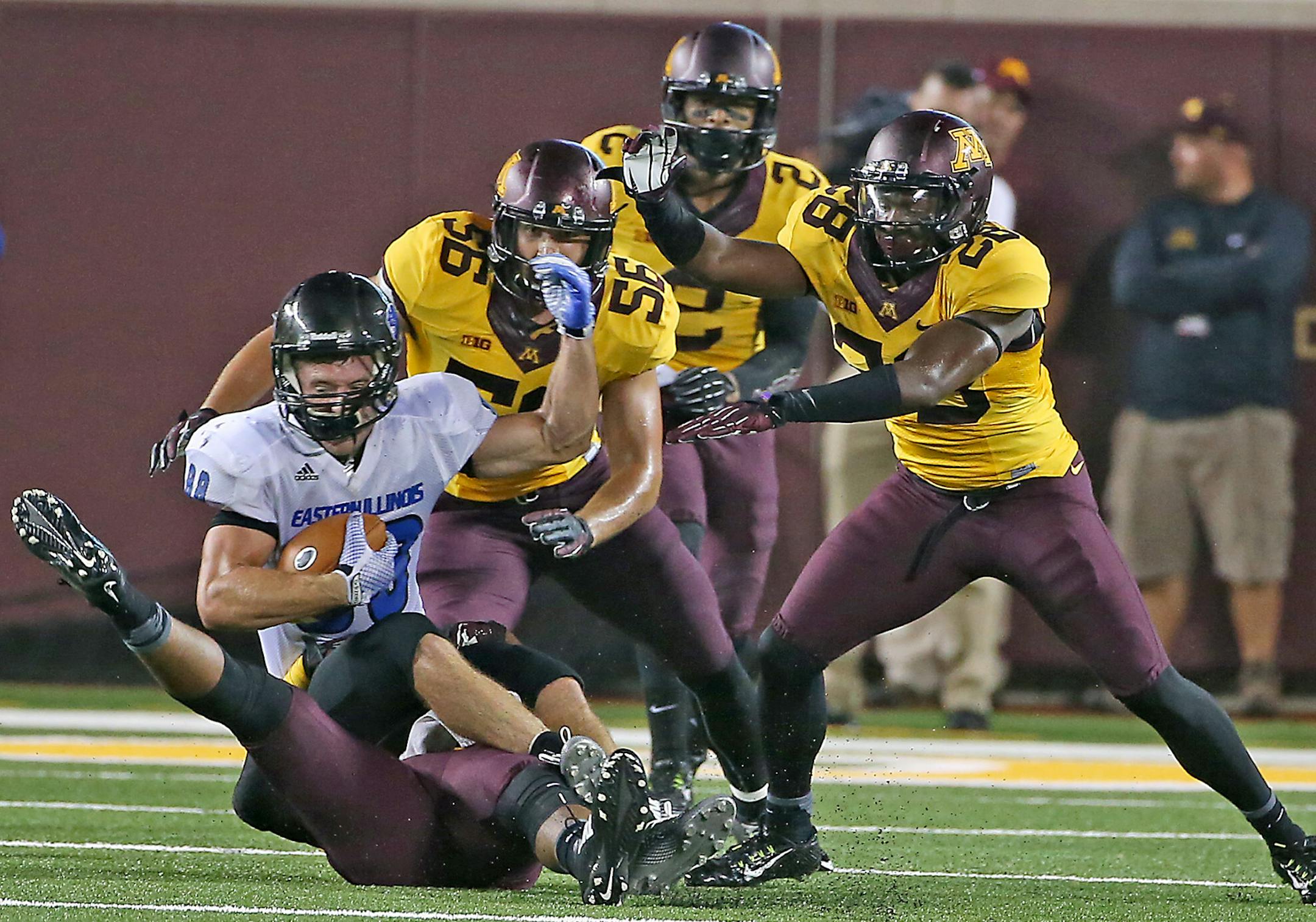 Minnesota defense was too much for Eastern Illinois wide receiver Adam Drake as he was brought down during the fourth quarter of the opening game against Eastern Illinois, Thursday, August 28, 2014 in Minneapolis, MN. ] (ELIZABETH FLORES/STAR TRIBUNE) ELIZABETH FLORES • eflores@startribune.com