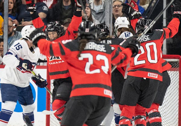 Team Canada’s Natalie Spooner (24), left, celebrated her first-period goal against the United States at Xcel Energy Center.