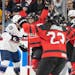 Team Canada’s Natalie Spooner (24), left, celebrated her first-period goal against the United States at Xcel Energy Center.