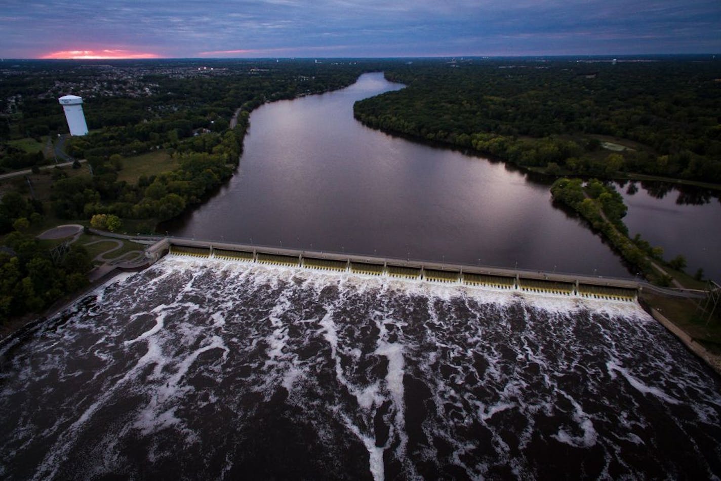 Water flows through the Coon Rapids Dam Tuesday afternoon.