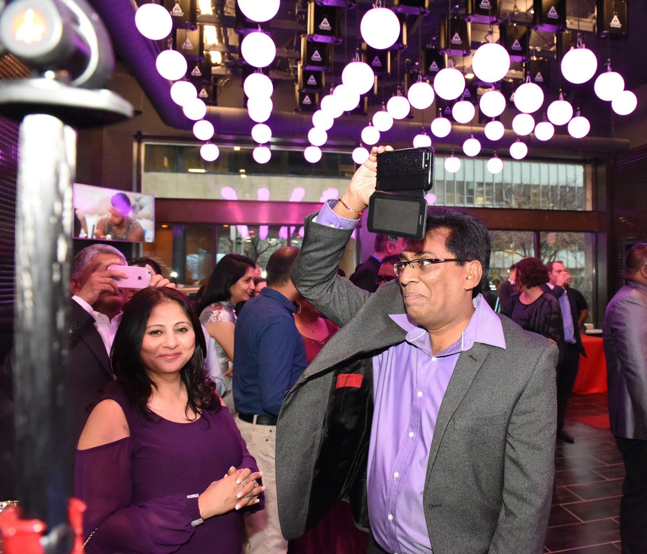 Guests mingled this month at an opening reception in the lobby of downtown's LuMinn Hotel. Photo by Joseph Naber