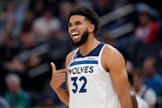 Minnesota Timberwolves center Karl-Anthony Towns (32) reacts to a foul call during the second Monday.