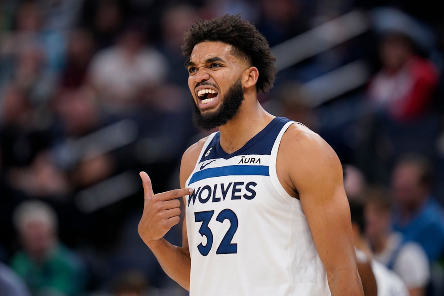 Minnesota Timberwolves center Karl-Anthony Towns (32) reacts to a foul call during the second Monday.