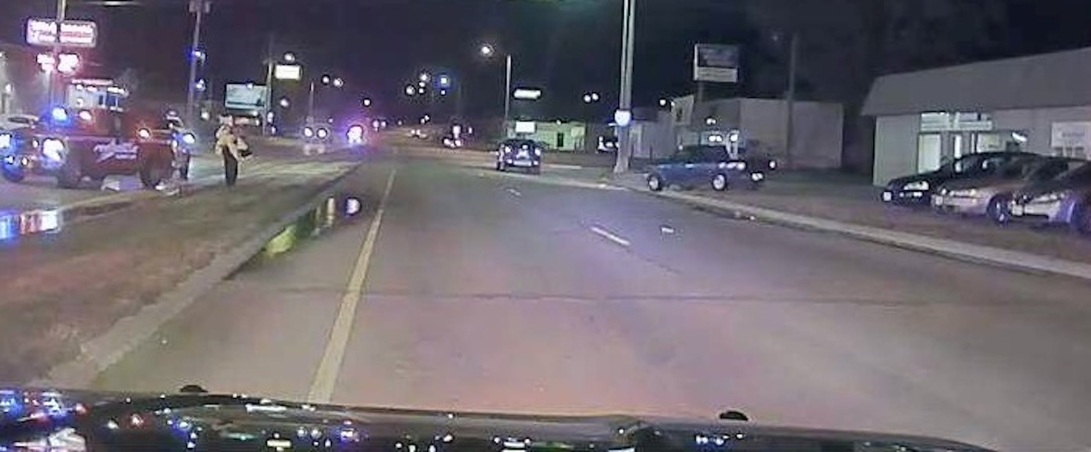 The blue pickup truck to the right is suspected of fatally striking a woman in Albert Lea, Minn., early Wednesday night.
