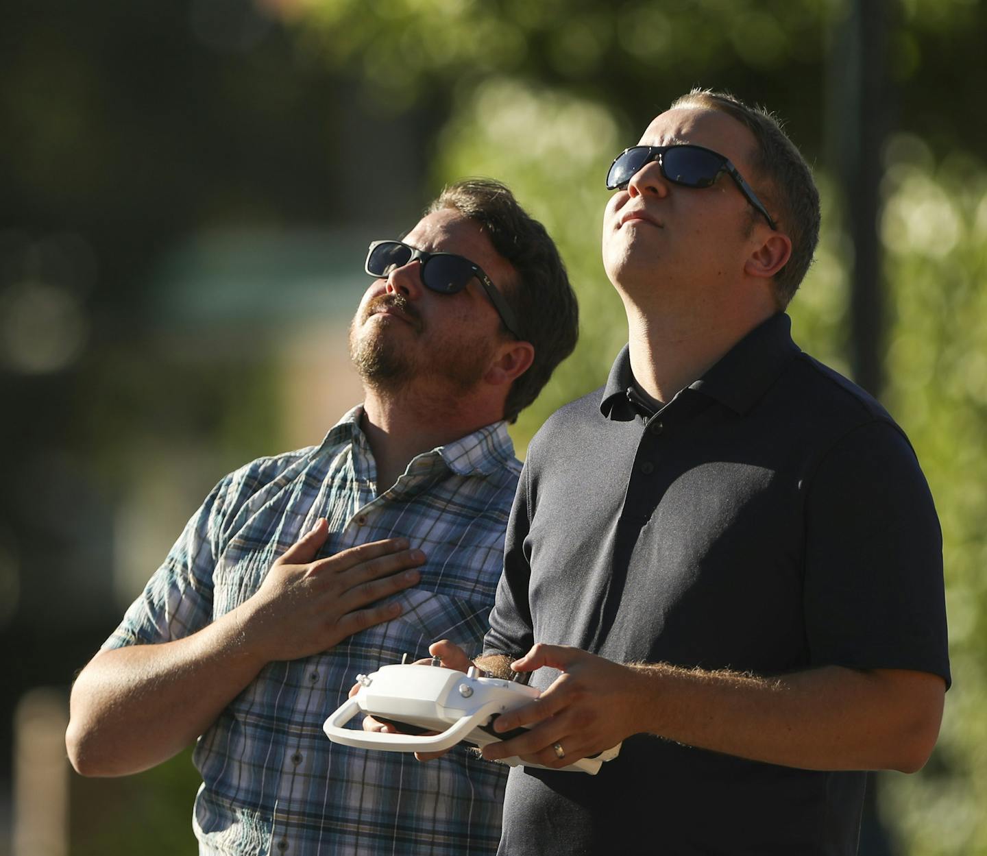 Sean Skinner, left, and Tyler Mason watched the drone piloted by Mason as it shot footage of the Robbinsdale water tower for a film Skinner is making. ] JEFF WHEELER &#xef; jeff.wheeler@startribune.com Tyler Mason, a drone operator with AirVuz, was working with Sean Skinner to shoot aerial footage of Robbinsdale Tuesday evening, July 12, 2016 for a film Skinner is making on the Terrace Theater.