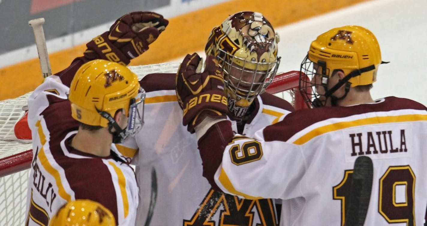 Gopher Hockey vs. Michigan State, Mariucci Arena, 10/12/12. (left to right) Gopher's Mike Reilly, Michael Shibrowski and Erik Haula celebrated their 5 to 1 win over Michigan State.