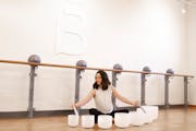 Kelly Smith, a yoga practitioner and podcaster, leads a Sound Bath class at Barre3 studio in Edina. 