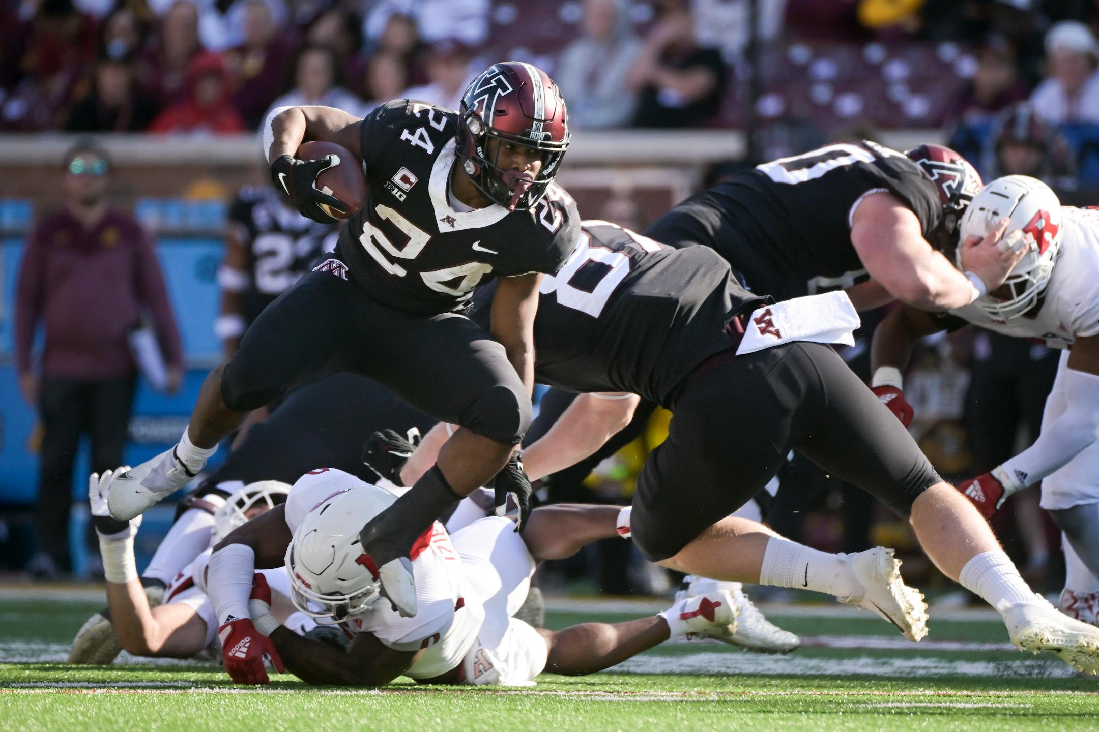 Minnesota Golden Gophers running back Mohamed Ibrahim (24) breaks a tackle during a second quarter.