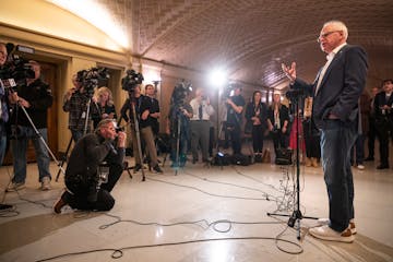 Gov. Tim Walz speaks to the press on the last day of the legislative session on May 19 at the State Capitol.