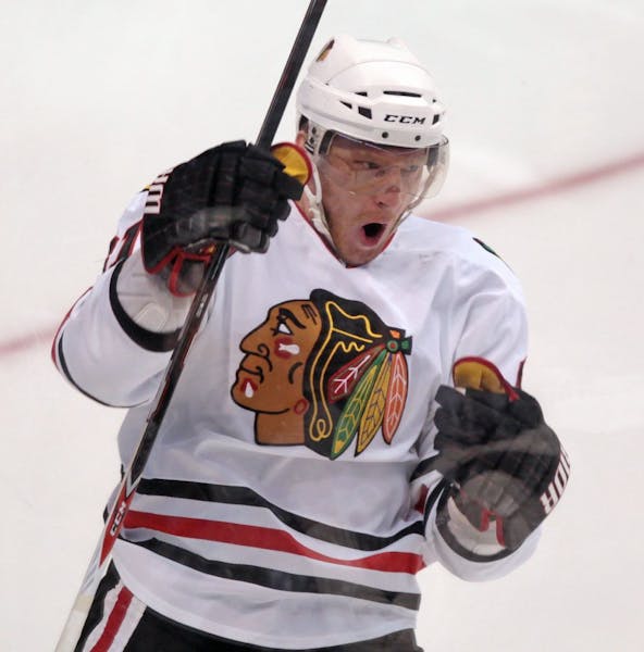 Chicago Blackhawks' Marian Hossa, of Slovakia, celebrates his goal against the Vancouver Canucks during the second period of Game 5 of an NHL hockey S