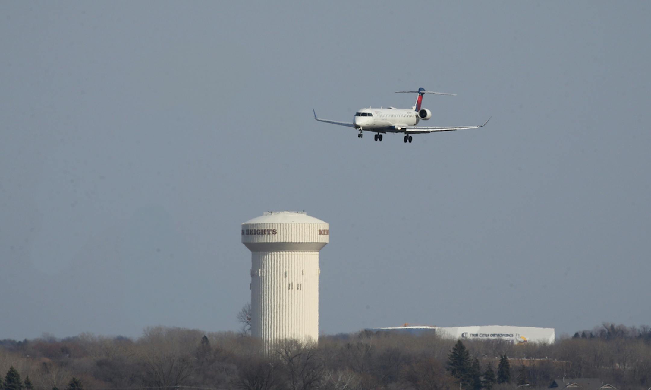 Prior to landing at MinneapolisÐSaint Paul International Airport on the Wednesday before the start of the NCAA Final Four tournament, this airplane was seen flying over the Minnesota Vikings practice facility in Eagan (right) and the Mendota Heights water tower. ] Shari L. Gross ¥ shari.gross@startribune.com The teams are set, now the airport is facing charter flight requests and the metro's reliever airports are fielding an onslaught of private jet reservations. The Super Bowl was good training