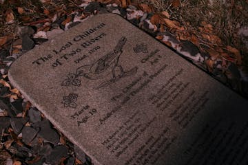 The granite marker for the graves of Maria and Christian Peterson, two siblings who in 1870 were lost in the woods near what is now Upsala, Minn., and