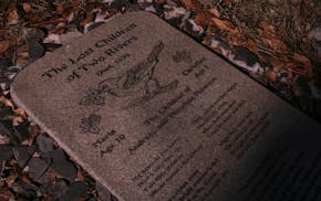 The granite marker for the graves of Maria and Christian Peterson, two siblings who in 1870 were lost in the woods near what is now Upsala, Minn., and