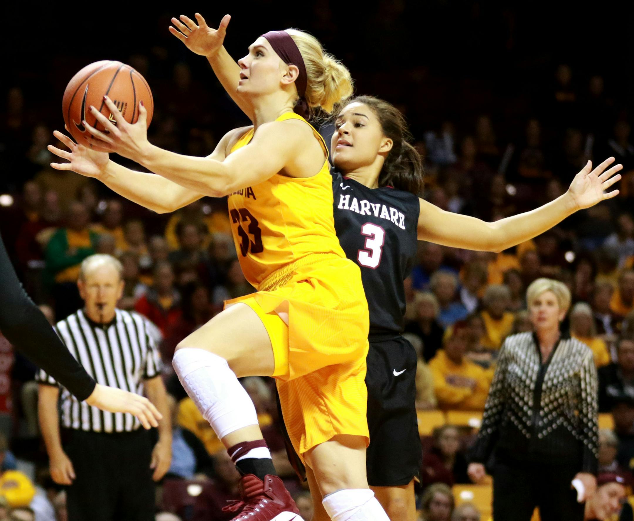 The University of Minnesota's Carlie Wagner (33) drives to the basket against Harvard's Katie Benzan (3) for two of her game high 27 points during the third quarter Saturday, Nov. 12, 2016, at Williams Arena on the University of Minnesota campus in Minneapolis, MN. The Gophers beat harvard 103-87.] (DAVID JOLES/STARTRIBUNE)djoles@startribune.com The University of Minnesota and Harvard Saturday, Nov. 12, 2016, at Williams Arena on the University of Minnesota campus in Minneapolis, MN.