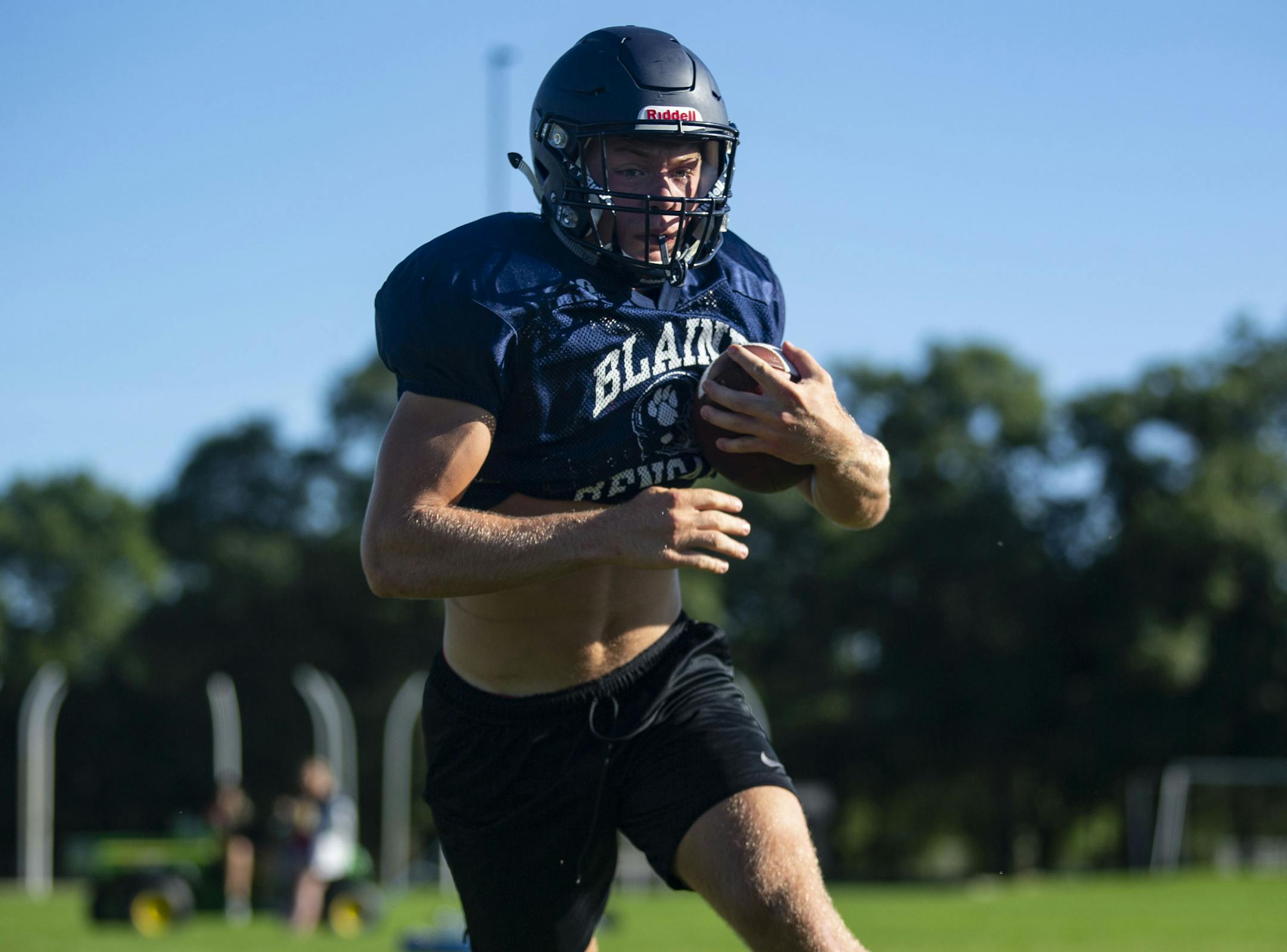Blaine High School running back Will Fredrickson ran drills at practice on the morning of Monday August 19, 2019. Frederickson was vocal and exuded confidence as a team leader.]
ALEX KORMANN &#x2022; alex.kormann@startribune.com The Blaine High School football team went 11-1 last season led by Coach Mike Law. This year the team's leaders are running back Will Frederickson and line backer Zach Schaffer.