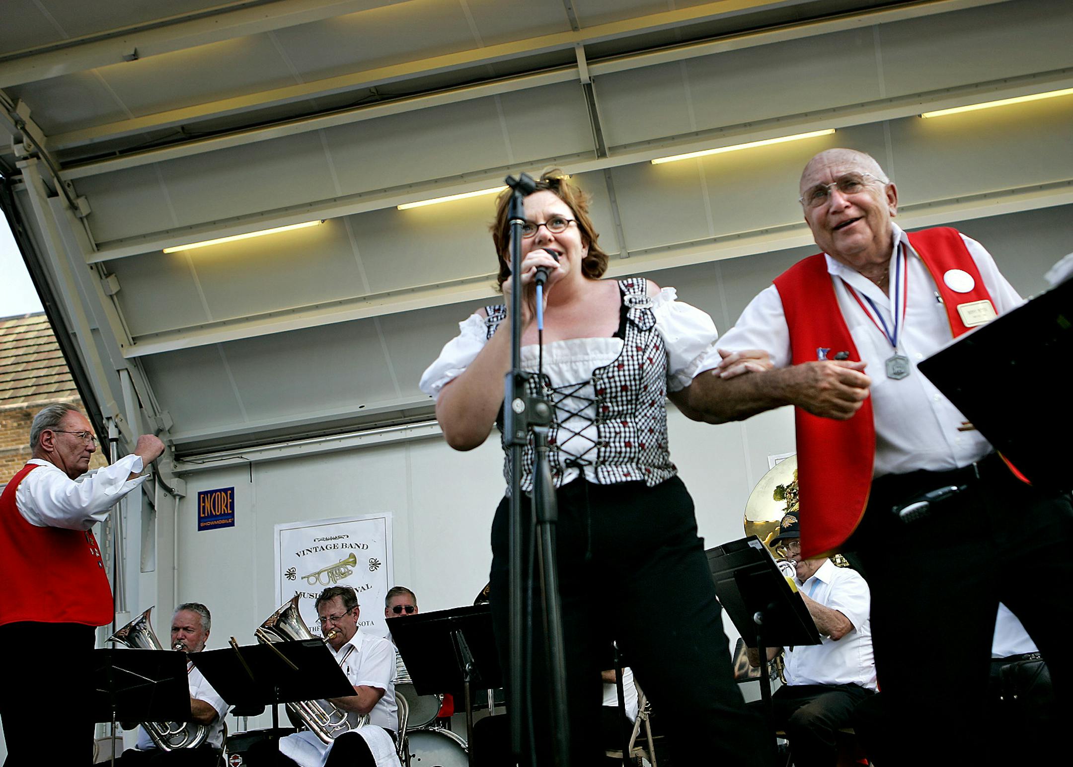 RAMIN RAHIMIAN Ô rrahimian@startribune.com Northfield, MN Ò July 28, 2006 Ò Heidi Werner, left, and Denny Warta of the Original German Band of New Ulm sang and danced as their band played on stage at Bridge Square during the Vintage Band Music Festival held July 27-30. Werner has been a vocalist with the band for 10 years and Warta, who started the band in 1985, is the bandÌs emcee and manager. The band focuses on the music of big brass bands of Germany and Austria. The festi