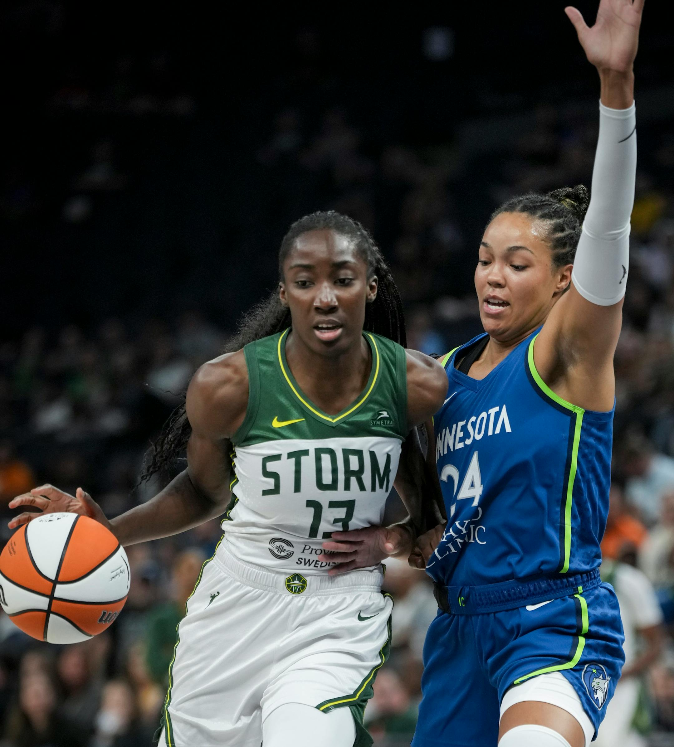 Minnesota Lynx forward Napheesa Collier (24) guards Seattle Storm center Ezi Magbegor (13) as she dribbles in the first half. The Minnesota Lynx hosted the Seattle Storm on Tuesday, June 27, 2023 at the Target Center in Minneapolis.